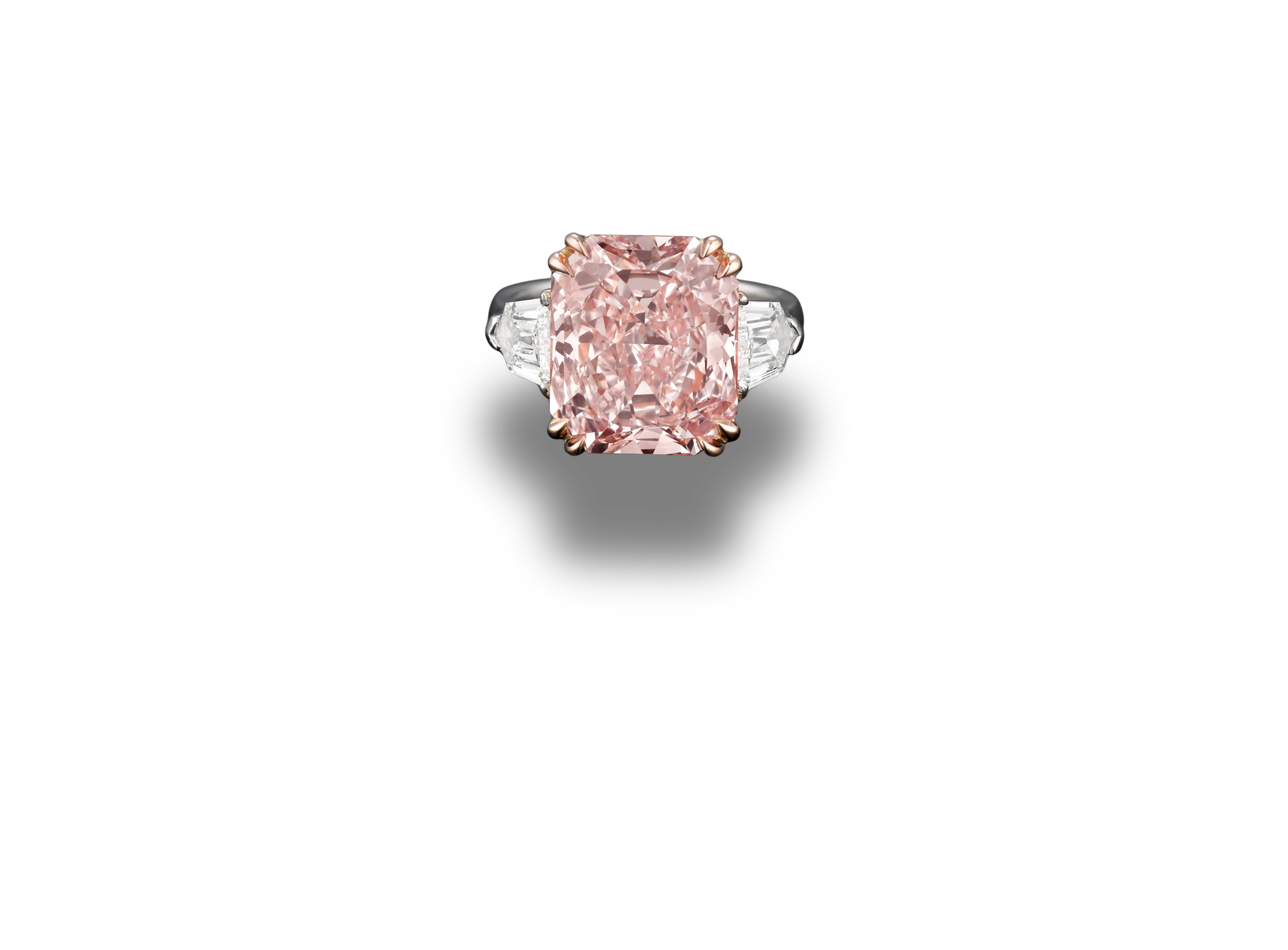 Natural pink diamond ring with cushion-cut centre stone and white diamond side stones